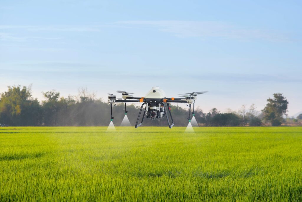 Agriculture,Drone,Flying,And,Spraying,Fertilizer,And,Pesticide,Over,Farmland,high